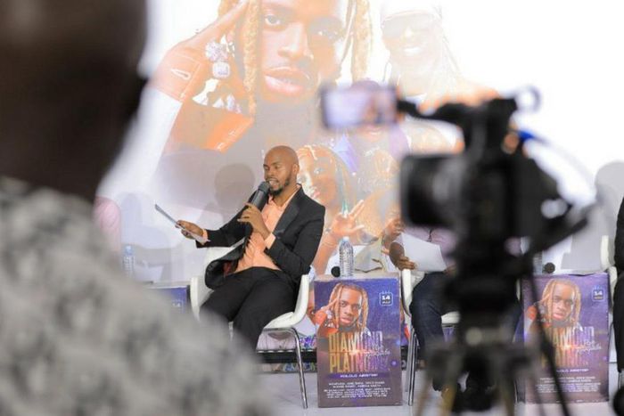 Comedy Store CEO Alex Muhangi speaking to the media on Monday, June 19 at UMA Multipurpose Hall in Kampala