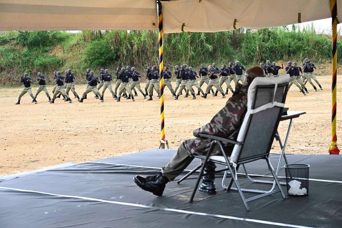 President Yoweri Museveni watches as the Police recruits showcase their skills at the Kabalye training school on Wednesday
