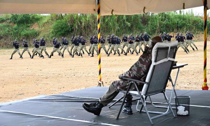 President Yoweri Museveni watches as the Police recruits showcase their skills at the Kabalye training school on Wednesday