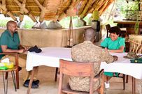 Gen. Kainerugaba (L) in conversation with UTB CEO Lilly Ajarova (green dress) and another official