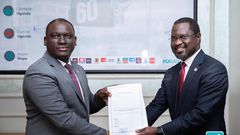 Next Media Group CEO Kin Kariisa(left) and Uganda Golf Union Presidenrt Dr. Jackson Were(right) after signing the MOU that makes NBS Sport the official Golf media partner