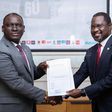 Next Media Group CEO Kin Kariisa(left) and Uganda Golf Union Presidenrt Dr. Jackson Were(right) after signing the MOU that makes NBS Sport the official Golf media partner