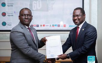 Next Media Group CEO Kin Kariisa(left) and Uganda Golf Union Presidenrt Dr. Jackson Were(right) after signing the MOU that makes NBS Sport the official Golf media partner