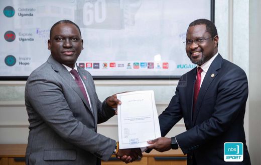 Next Media Group CEO Kin Kariisa(left) and Uganda Golf Union Presidenrt Dr. Jackson Were(right) after signing the MOU that makes NBS Sport the official Golf media partner