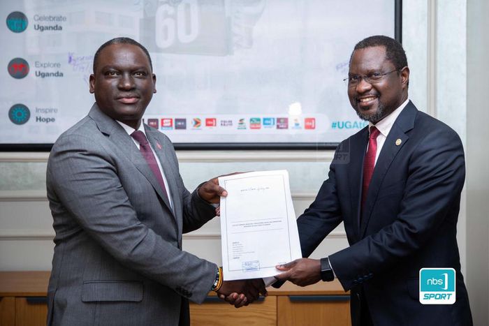 Next Media Group CEO Kin Kariisa(left) and Uganda Golf Union Presidenrt Dr. Jackson Were(right) after signing the MOU that makes NBS Sport the official Golf media partner