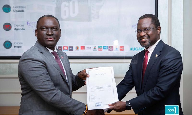 Next Media Group CEO Kin Kariisa(left) and Uganda Golf Union Presidenrt Dr. Jackson Were(right) after signing the MOU that makes NBS Sport the official Golf media partner