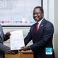 Next Media Group CEO Kin Kariisa(left) and Uganda Golf Union Presidenrt Dr. Jackson Were(right) after signing the MOU that makes NBS Sport the official Golf media partner