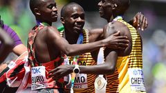 EUGENE, OREGON - JULY 17: Gold medalist Joshua Cheptegei of Team Uganda, silver medalist Stanley Waithaka Mburu of Team Kenya and bronze medalist Jacob Kiplimo of Team Uganda celebrate after the Men's 10,000m Final on day three of the World Athletics C...