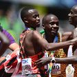 EUGENE, OREGON - JULY 17: Gold medalist Joshua Cheptegei of Team Uganda, silver medalist Stanley Waithaka Mburu of Team Kenya and bronze medalist Jacob Kiplimo of Team Uganda celebrate after the Men's 10,000m Final on day three of the World Athletics C...