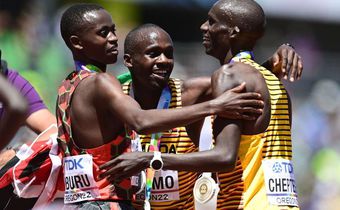 EUGENE, OREGON - JULY 17: Gold medalist Joshua Cheptegei of Team Uganda, silver medalist Stanley Waithaka Mburu of Team Kenya and bronze medalist Jacob Kiplimo of Team Uganda celebrate after the Men's 10,000m Final on day three of the World Athletics C...