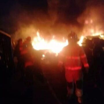 Firemen putting out the flames