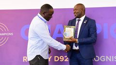 Next Media Group CEO Kin Kariisa (left) receiving the accolade at the 99th District 9214 Rotary Leadership Conference held in Munyonyo.