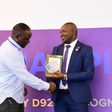 Next Media Group CEO Kin Kariisa (left) receiving the accolade at the 99th District 9214 Rotary Leadership Conference held in Munyonyo.