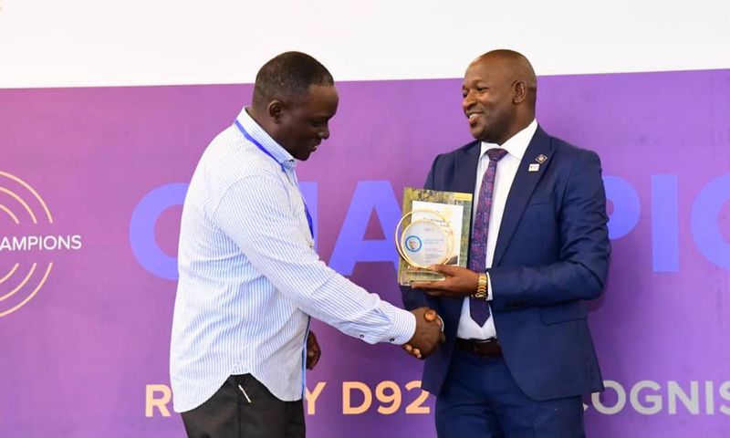 Next Media Group CEO Kin Kariisa (left) receiving the accolade at the 99th District 9214 Rotary Leadership Conference held in Munyonyo.