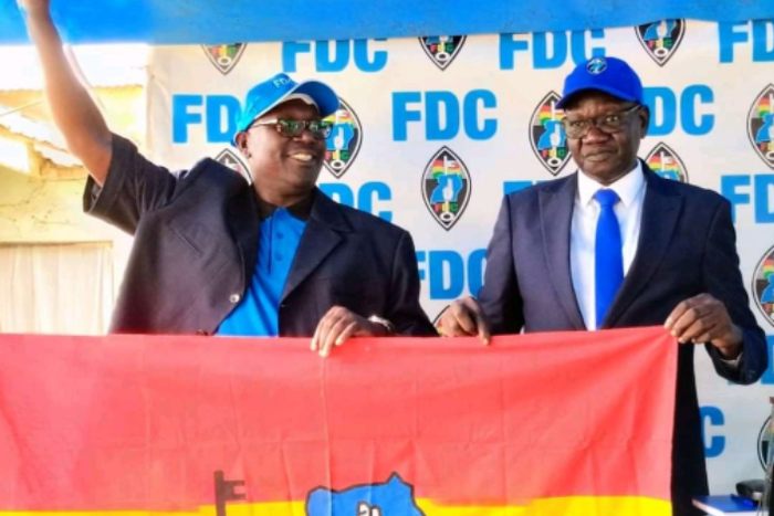 Dick Denis Owani, the flagbearer for the Forum for Democratic Change (FDC) Party and party president (right)  Eng Patrick Amuriat