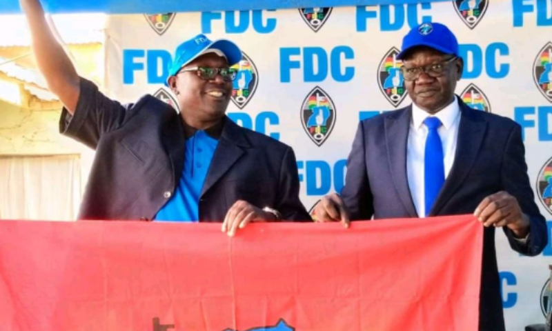 Dick Denis Owani, the flagbearer for the Forum for Democratic Change (FDC) Party and party president (right)  Eng Patrick Amuriat