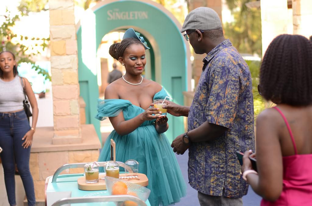 Andrew Kilonzo, Marketing Director UBL, grabs a cocktail during the recently concluded Singleton Food Pairing Experiences at Stone Haven in Kololo.