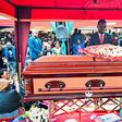 Bobi Wine lays a writh at the funeral of Joseph Nsamba