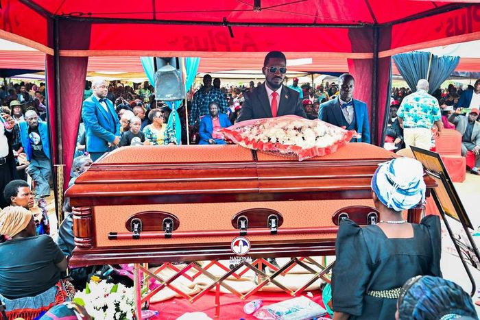 Bobi Wine lays a writh at the funeral of Joseph Nsamba