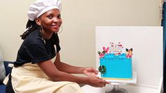 Mary Nankinga Kawuki showing off a cake she made
