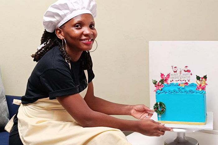 Mary Nankinga Kawuki showing off a cake she made