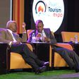 Tourism Minister Tom Butime (L) and his Junior Martin Mugarra Bahinduka at the Pearl of Africa Tourism Expo on Wednesday