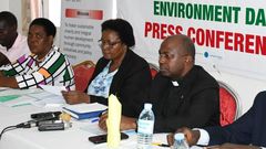 Fr. Hilary Muheezangango, the Caritas National Director (R) addressing press on Thursday ahead of the World Environment Day