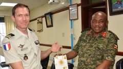 Maj. Gen. Jackson Bakasumba with Lt. Col. Yam Chollet