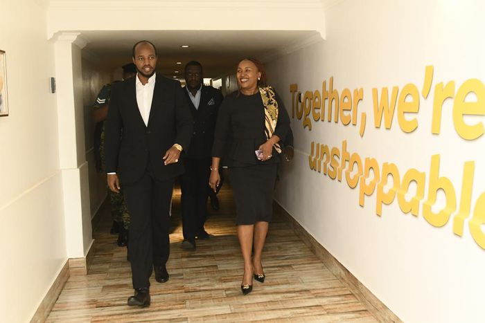The MTN Uganda CEO (R) gives His Majesty King Oyo (L) a tour of the MTN Uganda head office