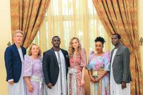 The couple posing with their parents