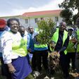 Kyakulya (centre) planting a tree to mark Human Rights Defenders Day. Photos by Ambrose Watanda