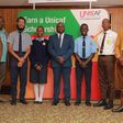 The essay competition winners posing with George Nasinyama, the V/C Unicaf University at Kampala Sheraton on Friday, August 4