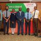 The essay competition winners posing with George Nasinyama, the V/C Unicaf University at Kampala Sheraton on Friday, August 4
