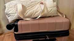 I recently ditched this duffel bag in favor of the pink roller suitcase beneath it.Amanda Krause/Insider