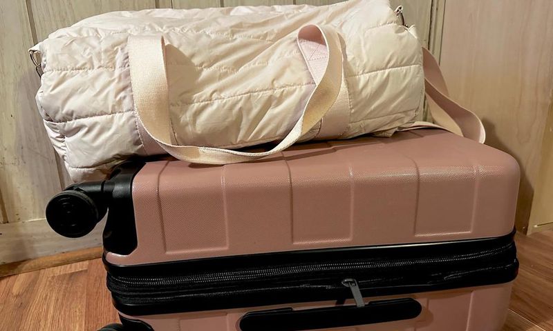 I recently ditched this duffel bag in favor of the pink roller suitcase beneath it.Amanda Krause/Insider