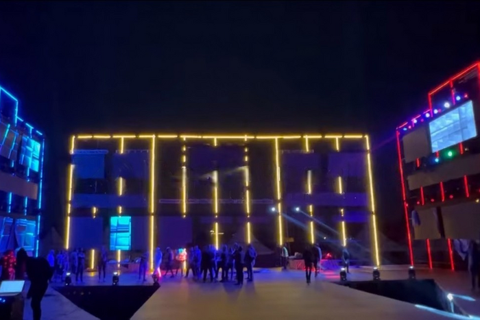 The massive stage, the size of a two-story building, is where everything is going down.