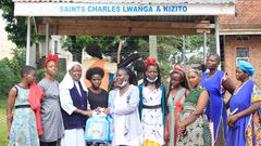 Sister Mary Lunyoro of Mbale Babies home receiving donations from Sheila Muwala Mulungi's Foundation