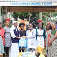 Sister Mary Lunyoro of Mbale Babies home receiving donations from Sheila Muwala Mulungi's Foundation