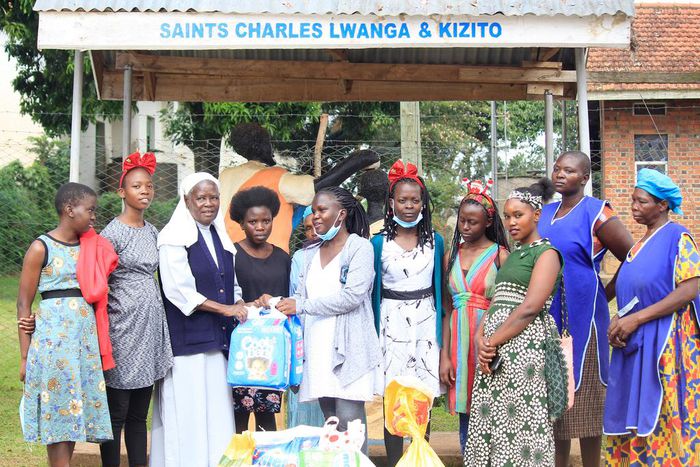 Sister Mary Lunyoro of Mbale Babies home receiving donations from Sheila Muwala Mulungi's Foundation