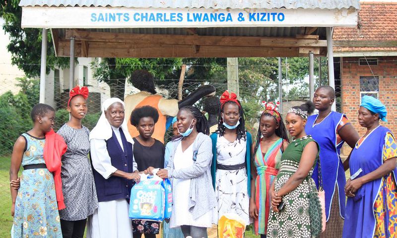 Sister Mary Lunyoro of Mbale Babies home receiving donations from Sheila Muwala Mulungi's Foundation