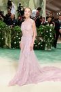 Phoebe Dynevor looked pretty in pink with her sheer gown.