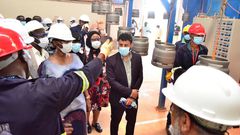 Hon Alice Kaboyo touring the cylinder factory