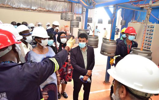 Hon Alice Kaboyo touring the cylinder factory