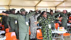 Ministers stretch up during the session