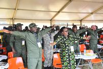Ministers stretch up during the session