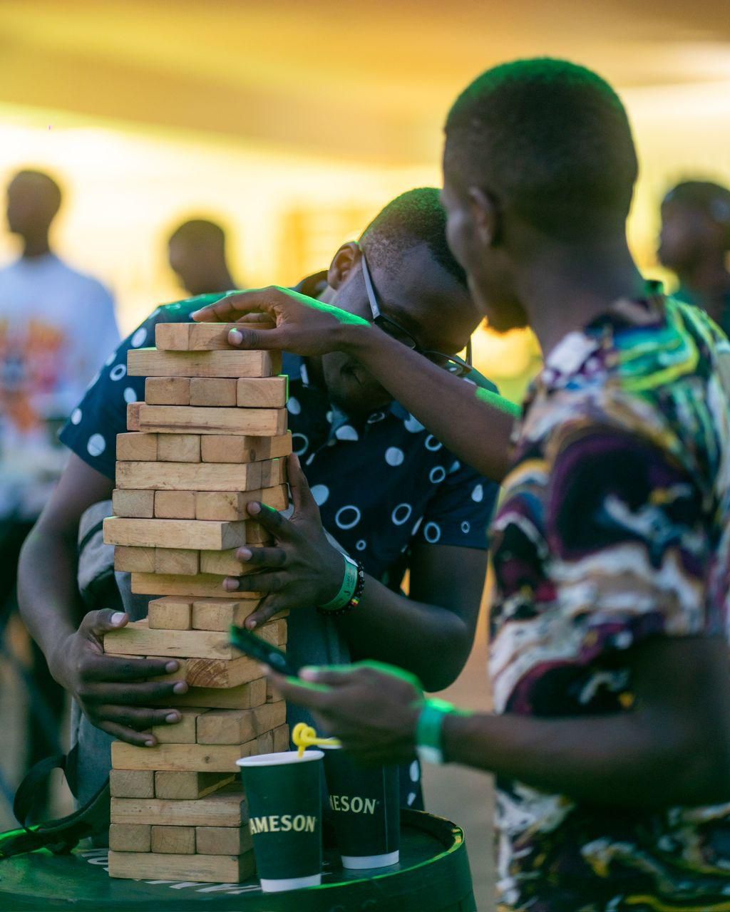 Partygoers enjoying a game of Jenga