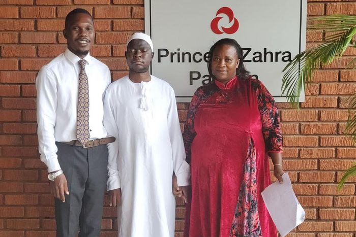 Hon Muhammad Ssegirinya (C) upon being discharged from Aga Khan hospital