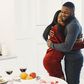 Man and woman hugging and Valentine dinner with wine on table [Image Credit: Gustavo Fring]