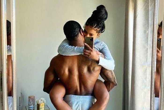 Couple taking mirror picture/Courtesy/Abby