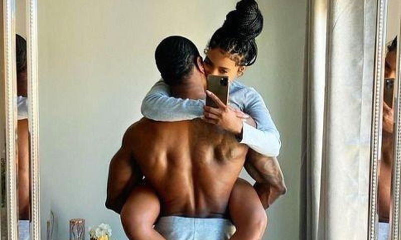 Couple taking mirror picture/Courtesy/Abby